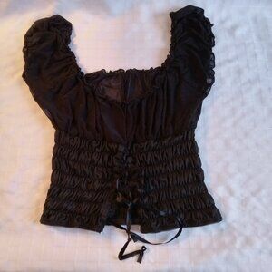 Pretty black baby doll with fringes skirt and short sleeve top in whith lace